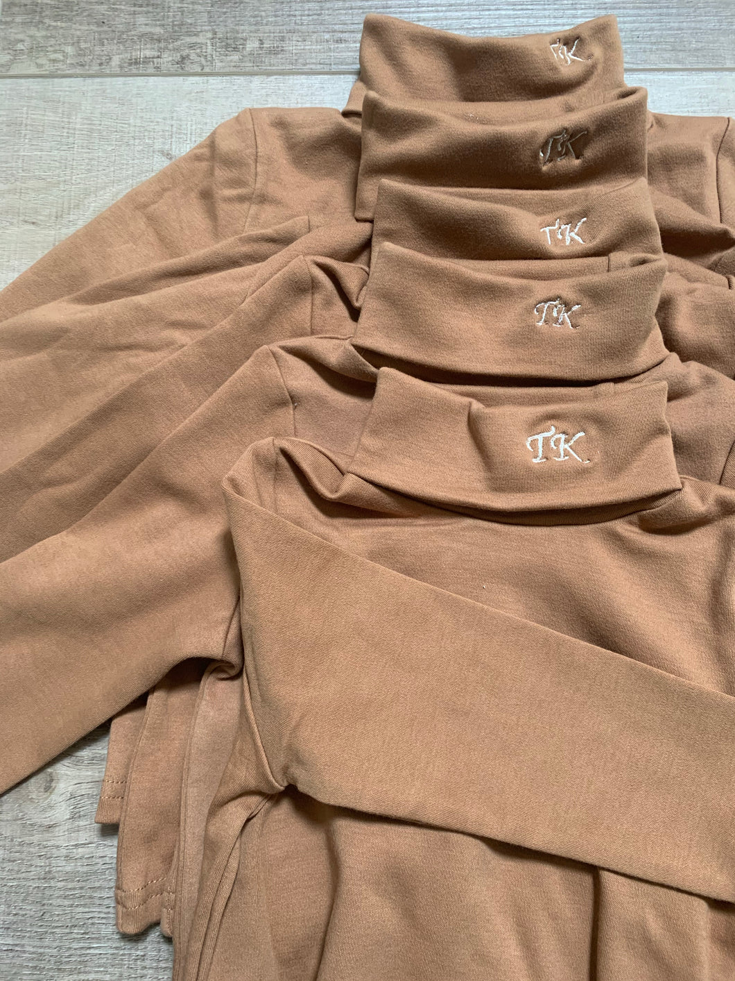 TK embroidered tan turtleneck